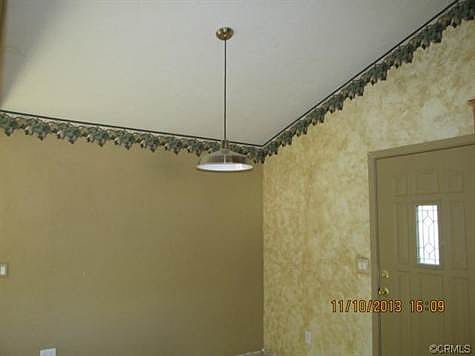 Vaulted ceiling in dining area adds architectural interest.