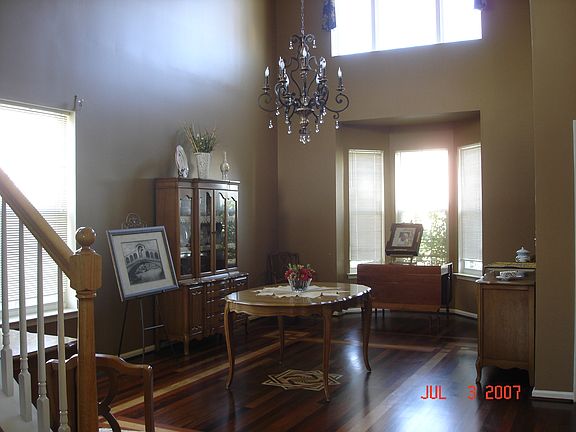 Dining Room w/ 2 story ceil.