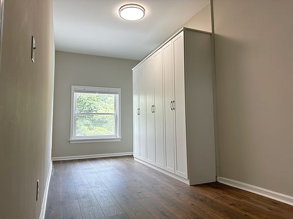 Bonus office/exercise space at top of stairs with custom storage.
