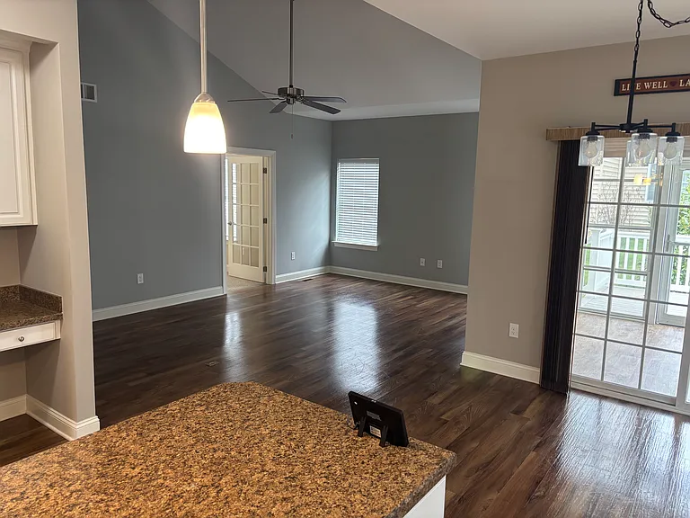 Looking from Kitchen to Family Room with vaulted ceilings