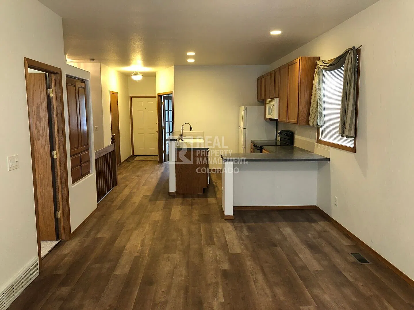 Spacious 2 Bed + 2 Offices | 2 Bath Duplex with Finished Basement, Fenced Yard & Garage in West L... — Photo 1