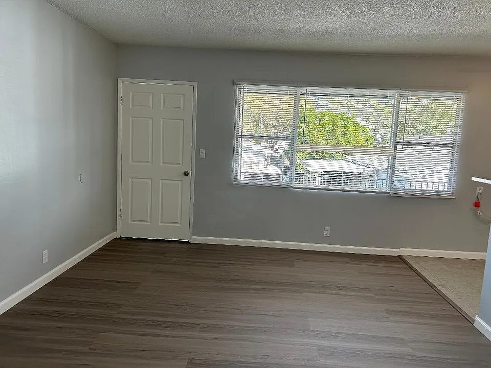 front Living room with brand new mini blinds, brand new linemate floor