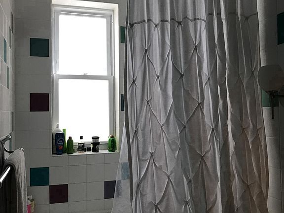 Bathroom with jacuzzi tub and rain shower