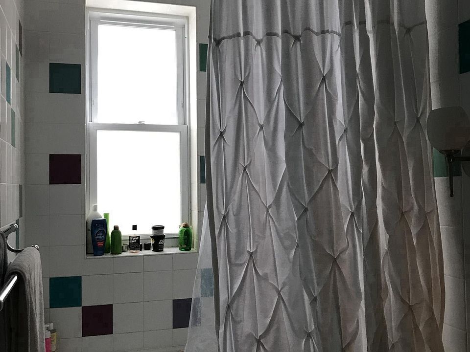 Bathroom with jacuzzi tub and rain shower