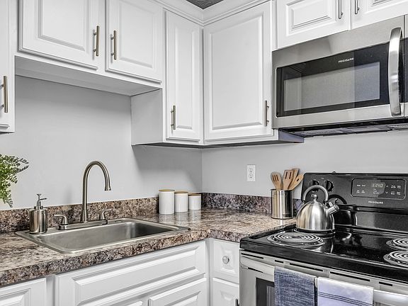 Discover a Culinary Haven in Our Modern, Open-Concept Kitchens!