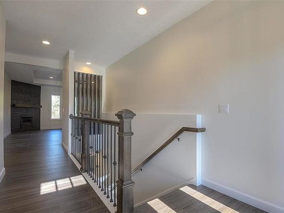 APPEALING ENTRY WITH WIDE LOWER LEVEL STAIRCASE