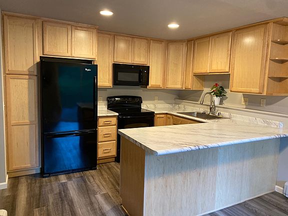 Newly remodeled kitchen with solid wood soft close cabinets and luxury vinyl plank flooring