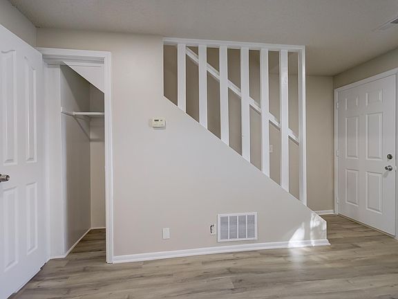 Storage in living room under the stairs