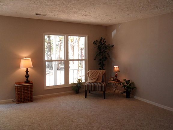 View towards the front in the living room - note this home has all new windows