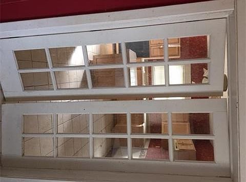 view of French doors in between dining room and kitchen