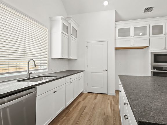 Kitchen with corner pantry