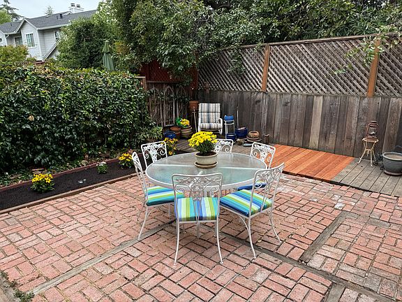 Ample patio area for entertaining, with planting area for gardening. Automatic watering system.
