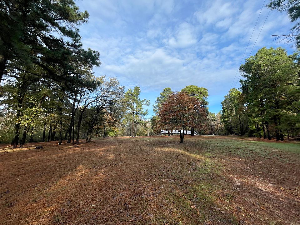 Expansive front yard area with garden ready land.