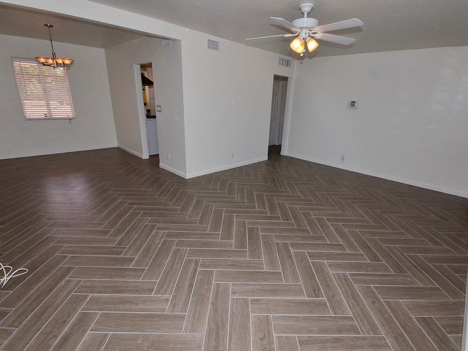 Large living room open to Dining area- gorgeous ceramic tile in herringbone pattern