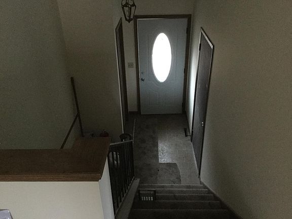 Front door with coat closet & 2 car garage entry