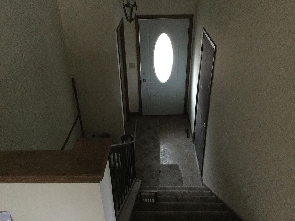 Front door with coat closet & 2 car garage entry