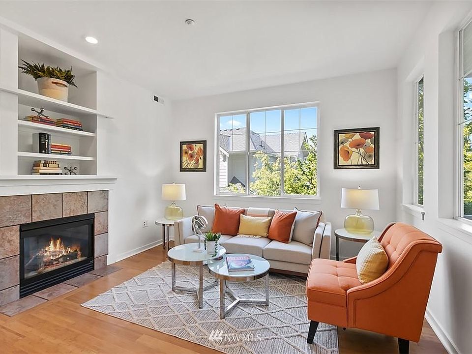 living room with fireplace and lot of natural light