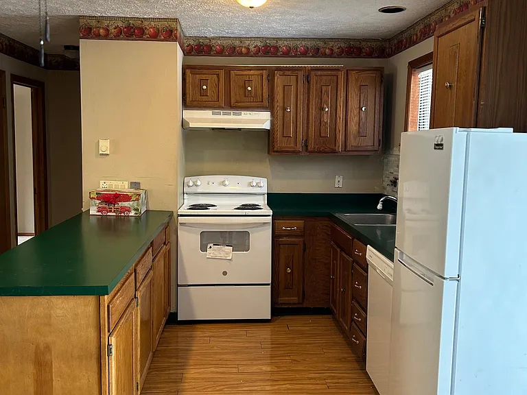 Kitchen cabinets have be upgraded and changed to white.