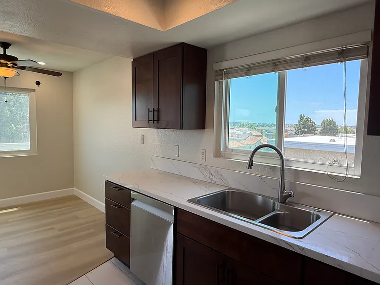 Kitchen with view toward ocean with adjacent dining room