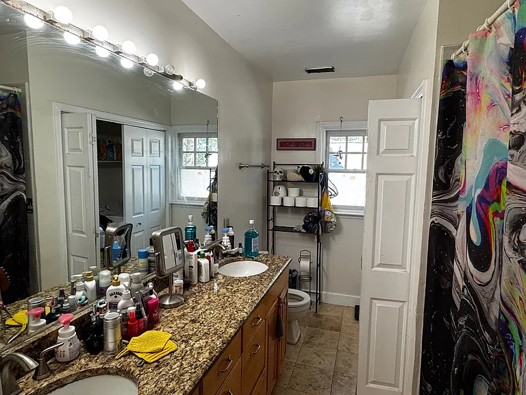 Bathroom. Two sinks. W/D supplied with unit in closet.