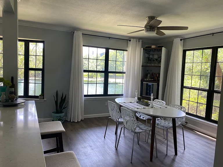 Bay window and large windows facing the pond with lots of natural light!