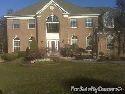 Front Yard : Full Brick Front, Custom Landscaping & Paver Walkways