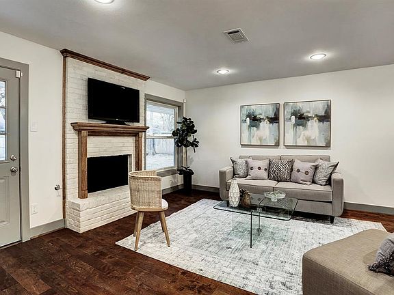 Beautiful hardwood floors, Brick fireplace, recessed lighting, energy efficient windows, and soft natural lighting.