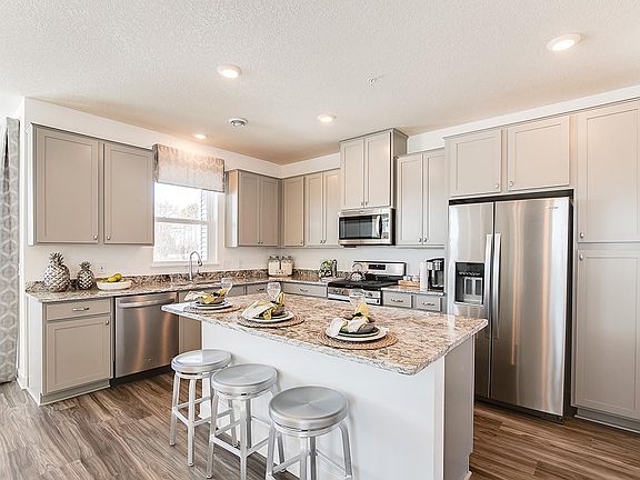 Kitchen with granite countertops and large center island.