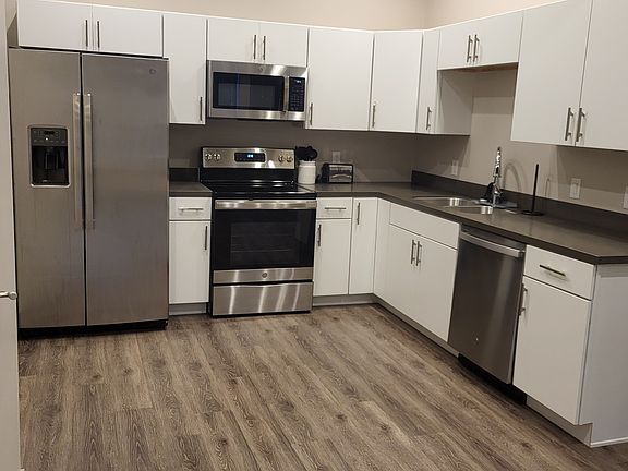 refrigerator, range, microwave, dishwasher, garbage disposal & custom cabinets