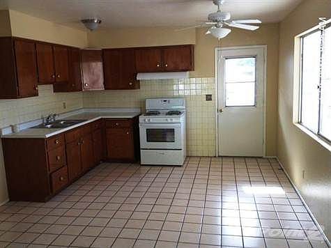 Tile floors. New sink, faucet, Range, Hood and light...