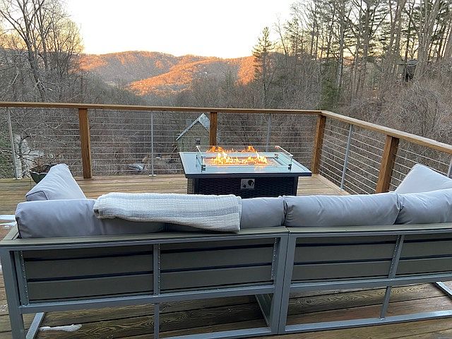 Upstairs back deck with fire table and gas grill