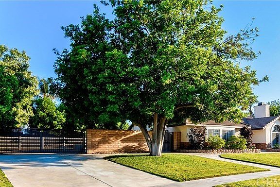 Second driveway leads to horse corral and backyard