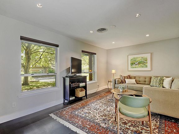 living area looking out windows to front yard