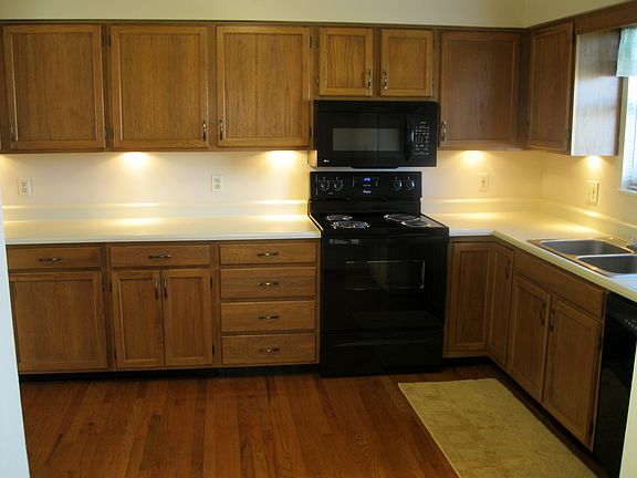 Hardwood floors in entry and Kitchen. Lighting underneath cabinets.