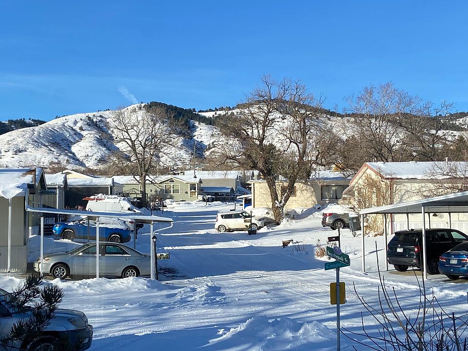 Front yard with year-round views of living room to Golden foothills just 5 minutes away