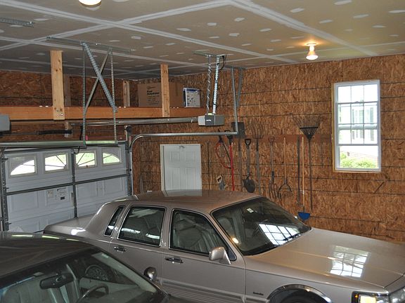 2 full-size cars in garage