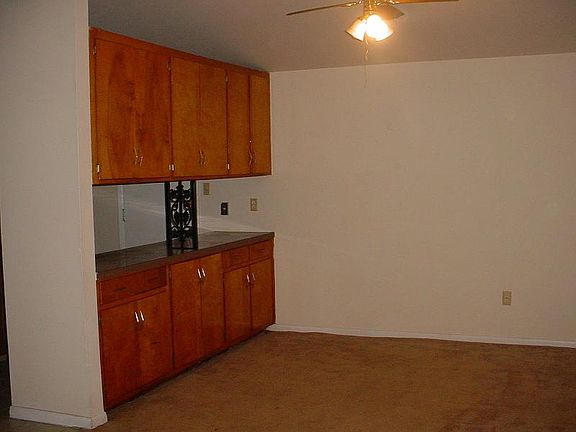 4303 View of diningroom with passthrough cabinets.