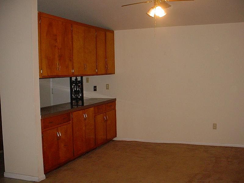 4303 View of diningroom with passthrough cabinets.