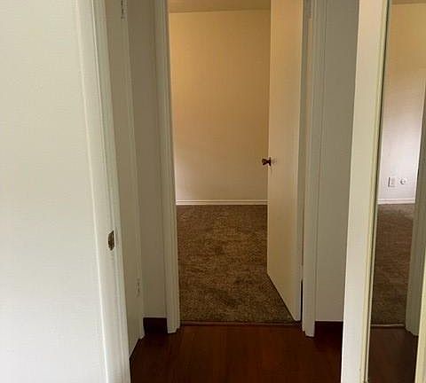looking across hall from bedroom to bedroom.
