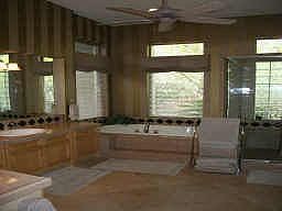 Master bath with Oversized double tub and tiled shower