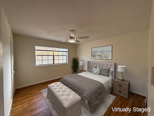 One of the 2 upstairs bedrooms-both are a generous size & both have ceiling fans.