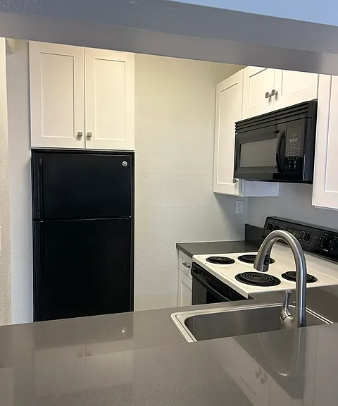 Newer cabinets and quartz counters
