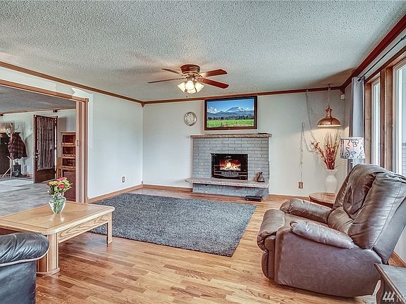 Gifts with Purchase... :-)...  Electric fireplaces and mounted TV!  Nice living room, great space and wonderful natural lighting.