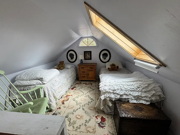 Twin beds in loft with stairs from bedroom 2