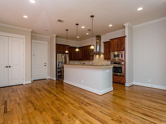 A perspective from the living area to the kitchen and dining area.