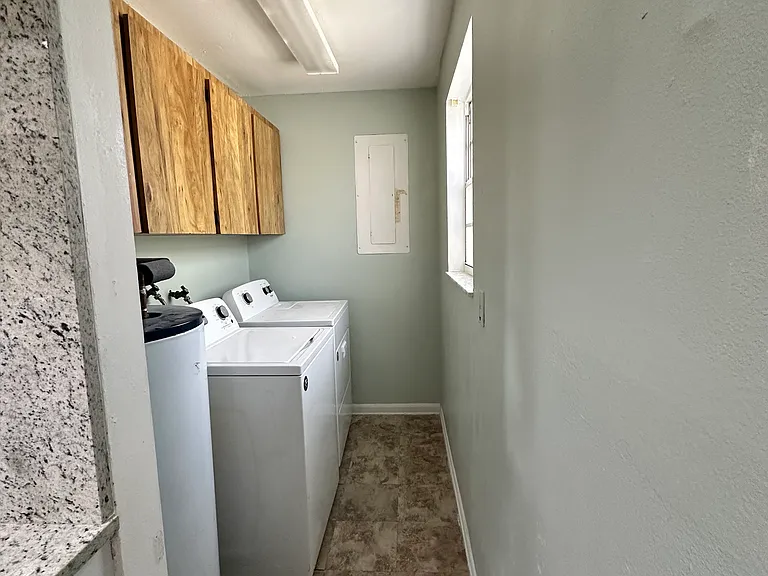 Laundry area with storage