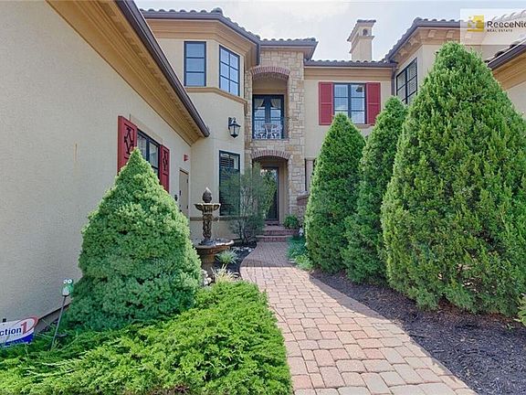 Your wonderful walkway & front door.  The covered patio belongs to the neighbors above.