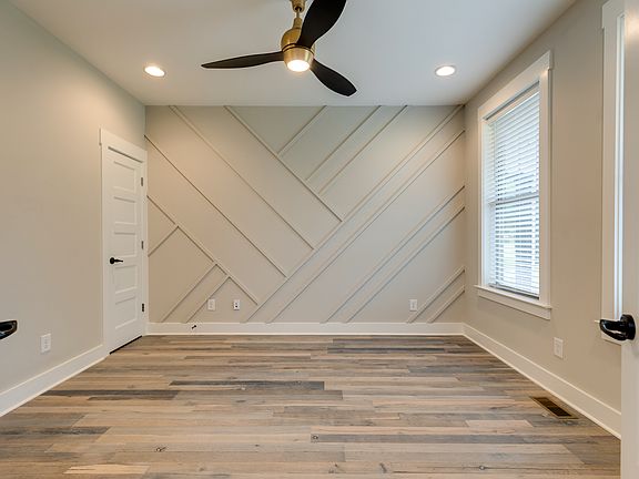 1st floor bedroom/office with direct bathroom access and walk in closet.