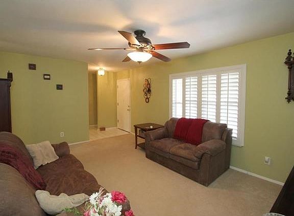 Spacious Family Room w/ plantation shutters & new carpet (not in pic.).