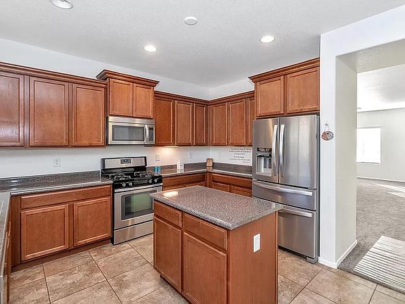 Kitchen with Stainless Steel Appliances, and partial view of entrance